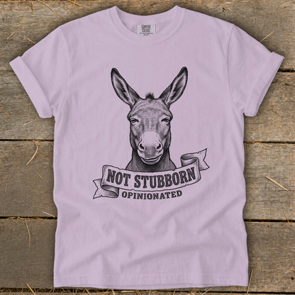 Light purple t-shirt with a sketch of a donkey and the text "NOT STUBBORN, OPINIONATED".
