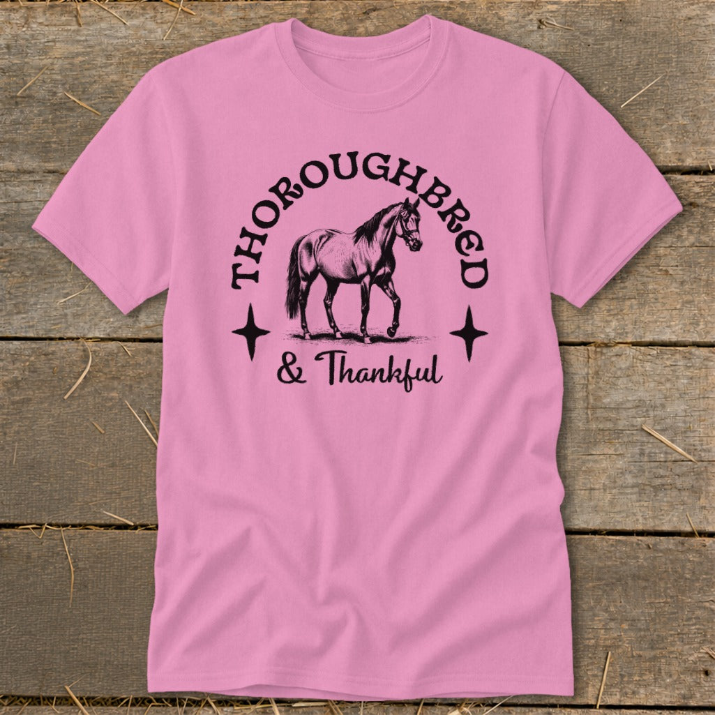 Pink t-shirt with "Thoroughbred & Thankful" text and a horse graphic.