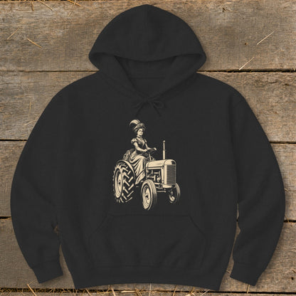 Woman in vintage dress driving a tractor, illustration on black hoodie.