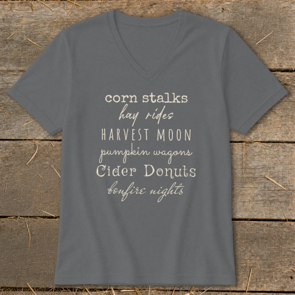 Gray v-neck t-shirt with fall-themed text: "corn stalks, hay rides, HARVEST MOON, pumpkin wagons, Cider Donuts, bonfire nights."