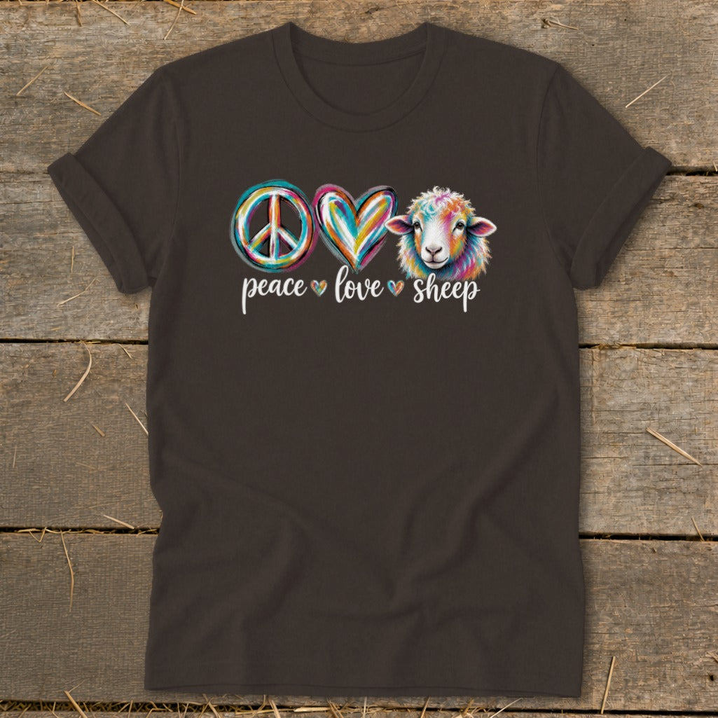 Dark t-shirt with colorful peace sign, heart, and sheep graphic that says "peace love sheep".
