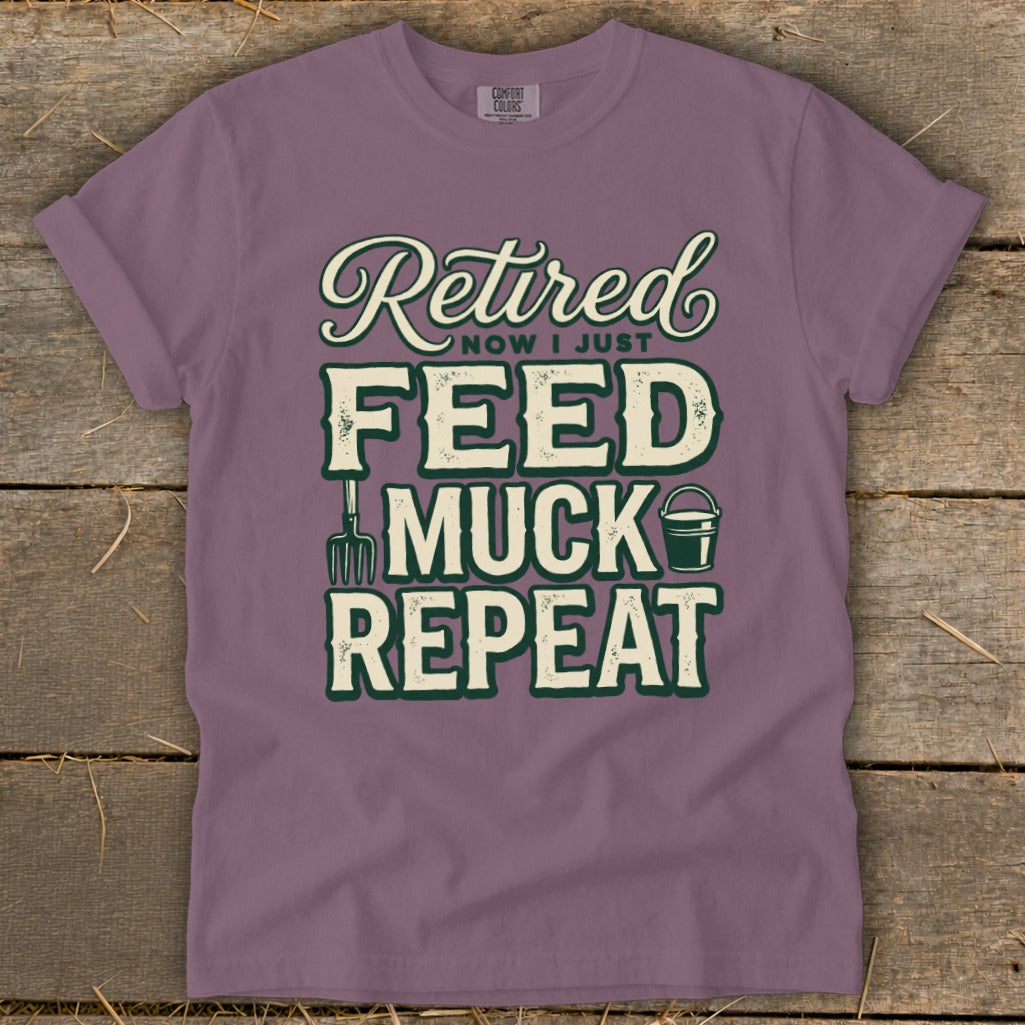 Purple t-shirt with "Retired Now I Just Feed Muck Repeat" text and graphics.