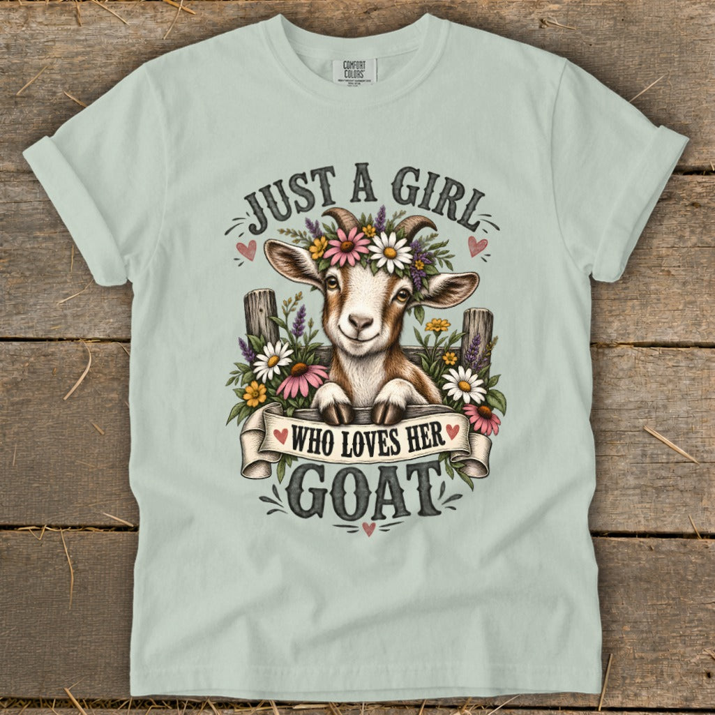 Light mint t-shirt with a smiling goat wearing a flower crown and banner saying "Just a girl who loves her goat".