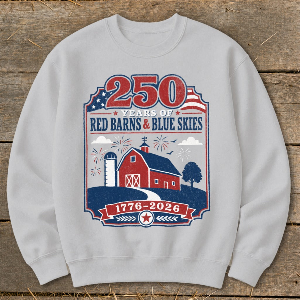 Sweatshirt with 250 Years of Red Barns & Blue Skies, 1776-2026 patriotic design.