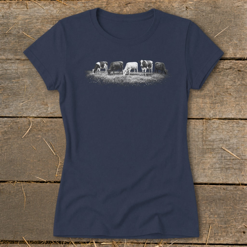 Dark blue t-shirt with a graphic of five cows grazing in a field.