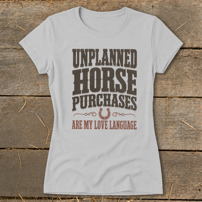Light gray t-shirt with text "UNPLANNED HORSE PURCHASES ARE MY LOVE LANGUAGE".