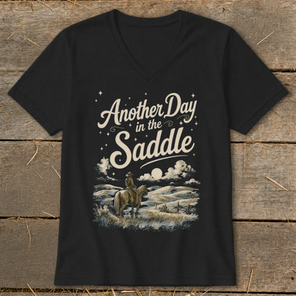 Black v-neck t-shirt with "Another Day in the Saddle" text and cowboy on horseback.