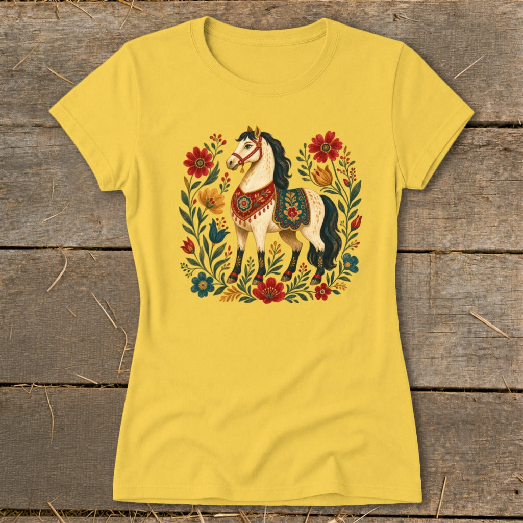 Yellow t-shirt with a white horse illustration surrounded by colorful flowers.
