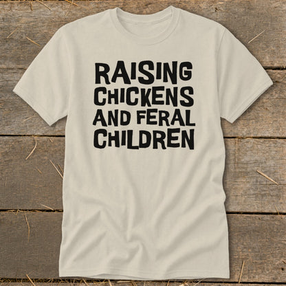 T-shirt with black text reading "Raising Chickens And Feral Children".