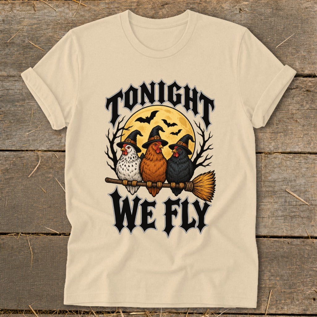 Three chickens wearing witch hats sit on a broomstick, with "Tonight We Fly" text.