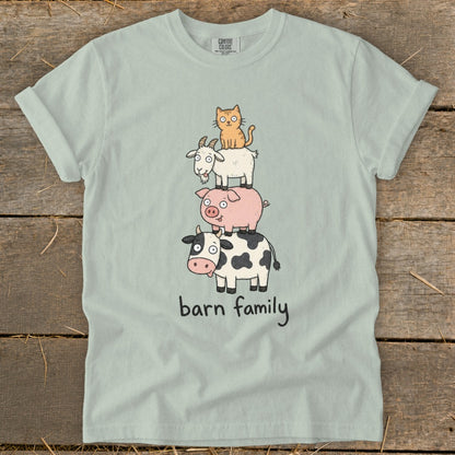 Light blue t-shirt with a stack of barn animals: cat, goat, pig, and cow; text reads "barn family".