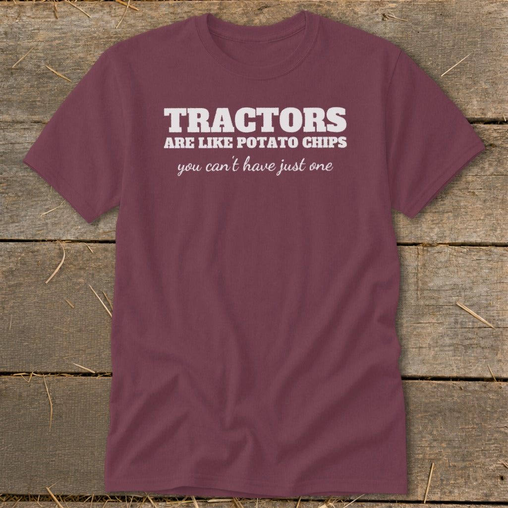 Maroon t-shirt with white text that reads "TRACTORS ARE LIKE POTATO CHIPS you can't have just one".