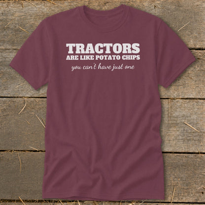 Maroon t-shirt with white text that reads "TRACTORS ARE LIKE POTATO CHIPS you can't have just one".