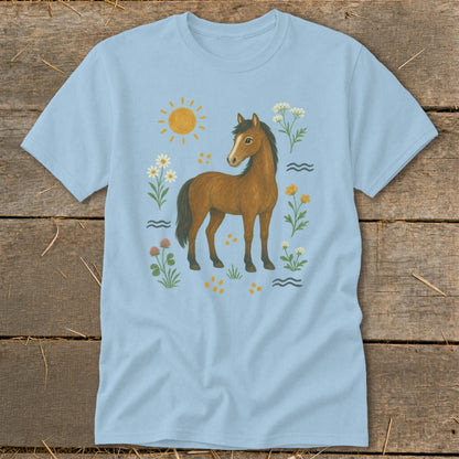 Light blue t-shirt with a brown horse surrounded by sun, flowers, and wavy lines.