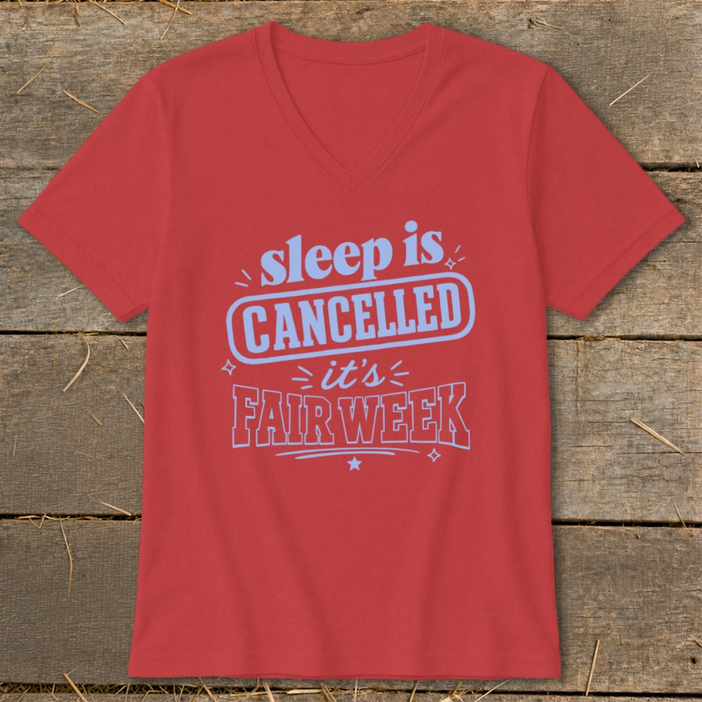 Coral v-neck t-shirt with blue text that reads "sleep is CANCELLED it's FAIR WEEK".