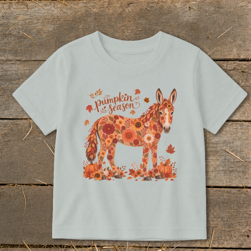 Donkey covered in flowers with "pumpkin season" text and pumpkins.