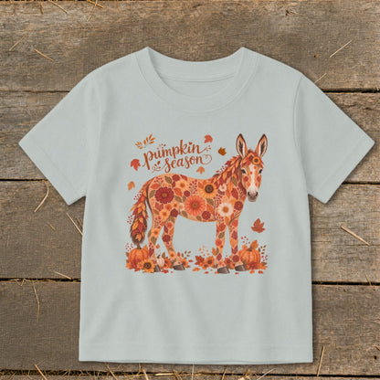 Donkey covered in flowers with "pumpkin season" text and pumpkins.