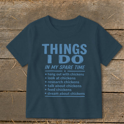 Blue t-shirt with "Things I Do In My Spare Time" and chicken-related activities.