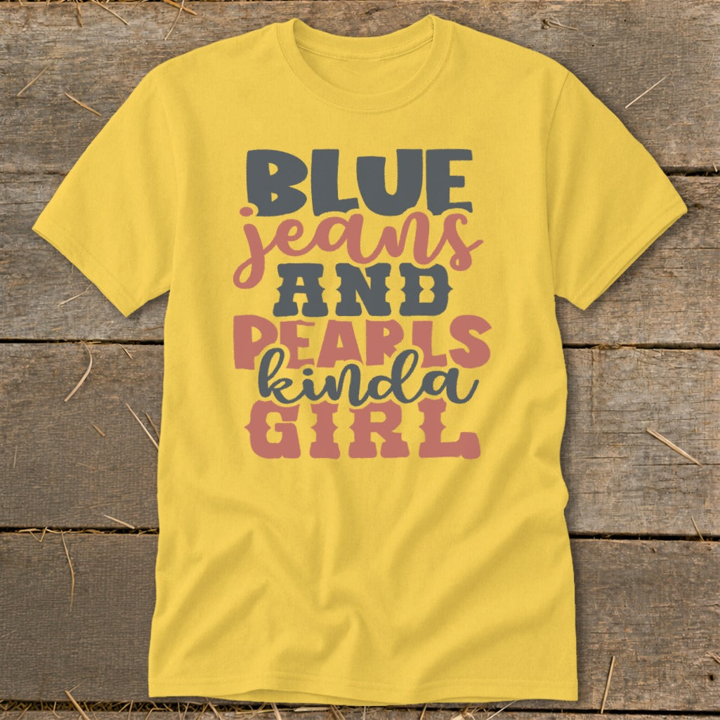 Yellow t-shirt with "Blue Jeans and Pearls Kinda Girl" text in multi-colored font.