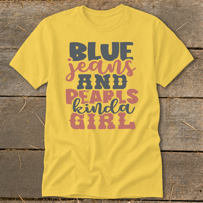 Yellow t-shirt with "Blue Jeans and Pearls Kinda Girl" text in multi-colored font.