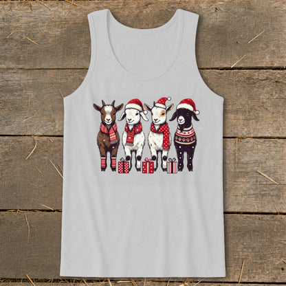 Four goats wearing Santa hats and scarves stand with presents.