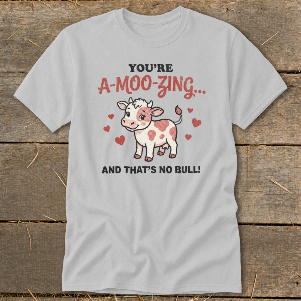 Light grey t-shirt with a cow graphic and text "YOU'RE A-MOO-ZING... AND THAT'S NO BULL!".