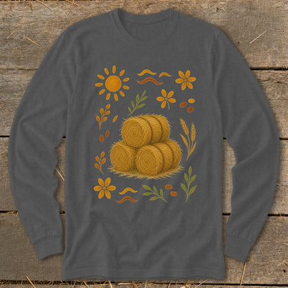 Long sleeve t-shirt with a stacked hay bale graphic and autumn elements.