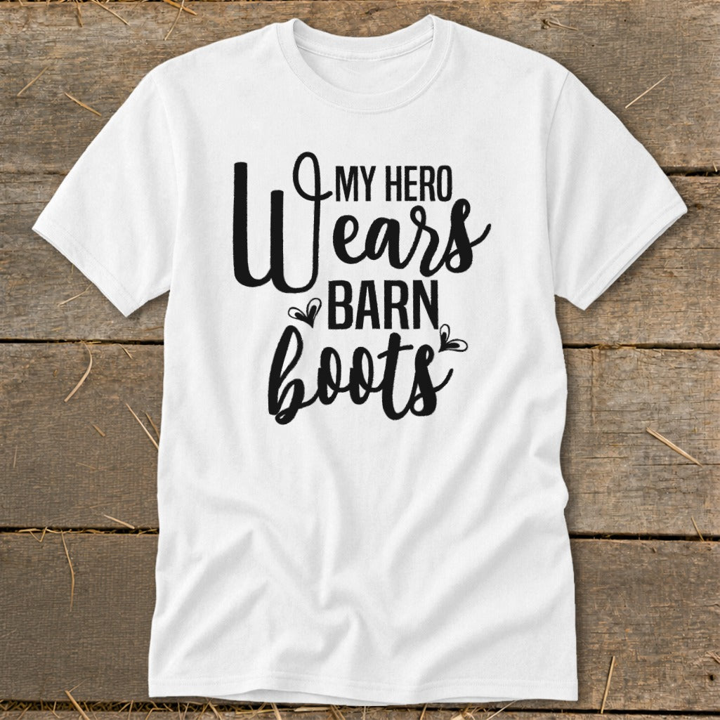 White t-shirt with "My Hero Wears Barn Boots" in black text.