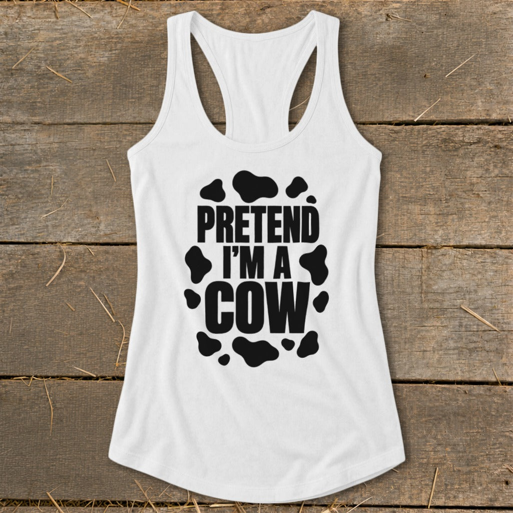 White tank top with black text reading "PRETEND I'M A COW" and cow spots.