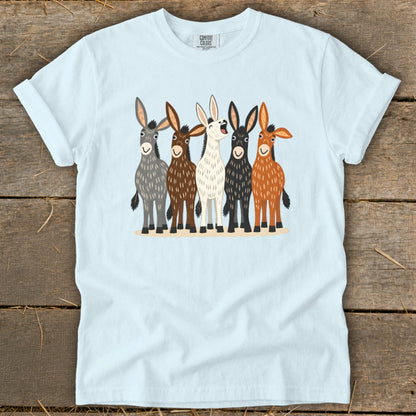 Light blue crewneck t-shirt featuring a front graphic of five colorful donkeys standing together.