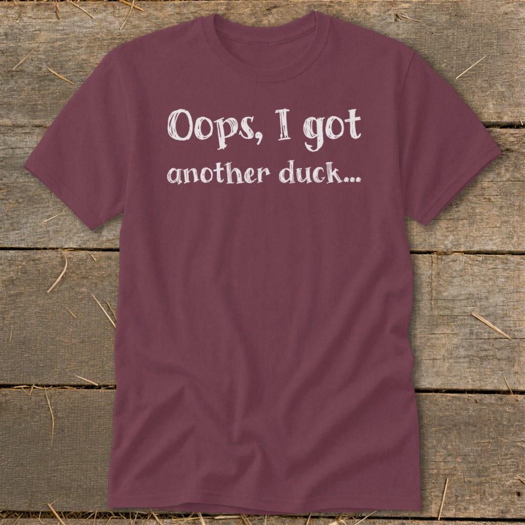 Maroon t-shirt with white text that reads "Oops, I got another duck..."