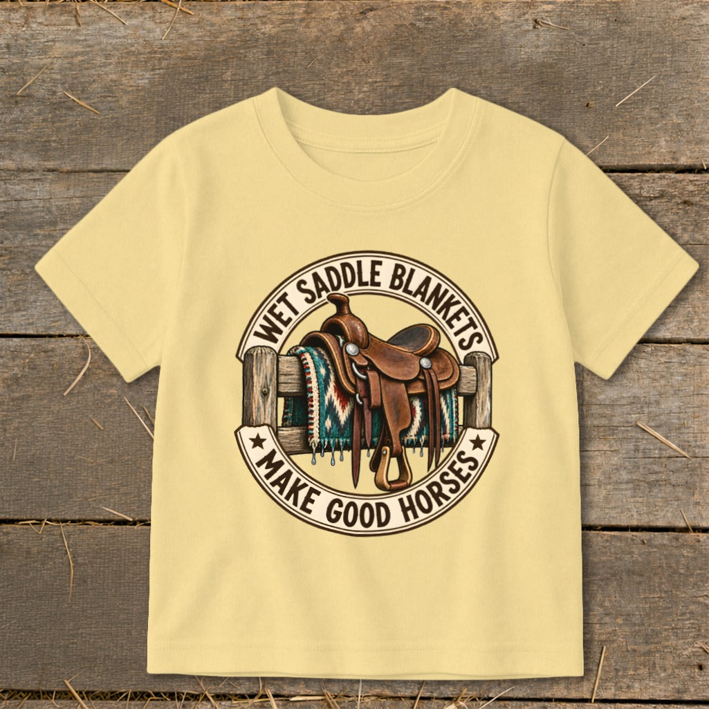 Yellow t-shirt with a graphic of a saddle and blanket on a fence with text.