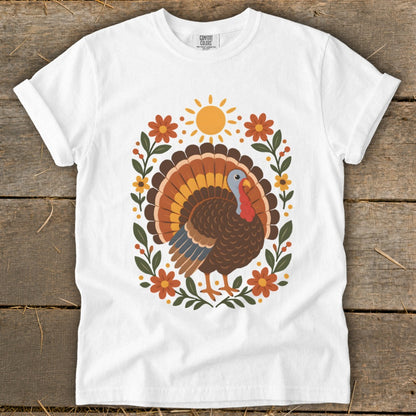 White t-shirt with a graphic of a turkey and floral elements.