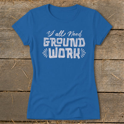 Blue t-shirt with white text reading "Y'all Need GROUND WORK".