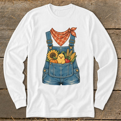 White long-sleeve shirt with cartoon overalls, chick, sunflower, corn, pumpkin, and apple.