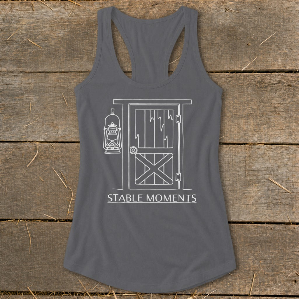 Gray tank top with white line drawing of barn door, lantern, and "STABLE MOMENTS" text.