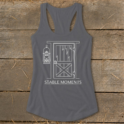 Gray tank top with white line drawing of barn door, lantern, and "STABLE MOMENTS" text.