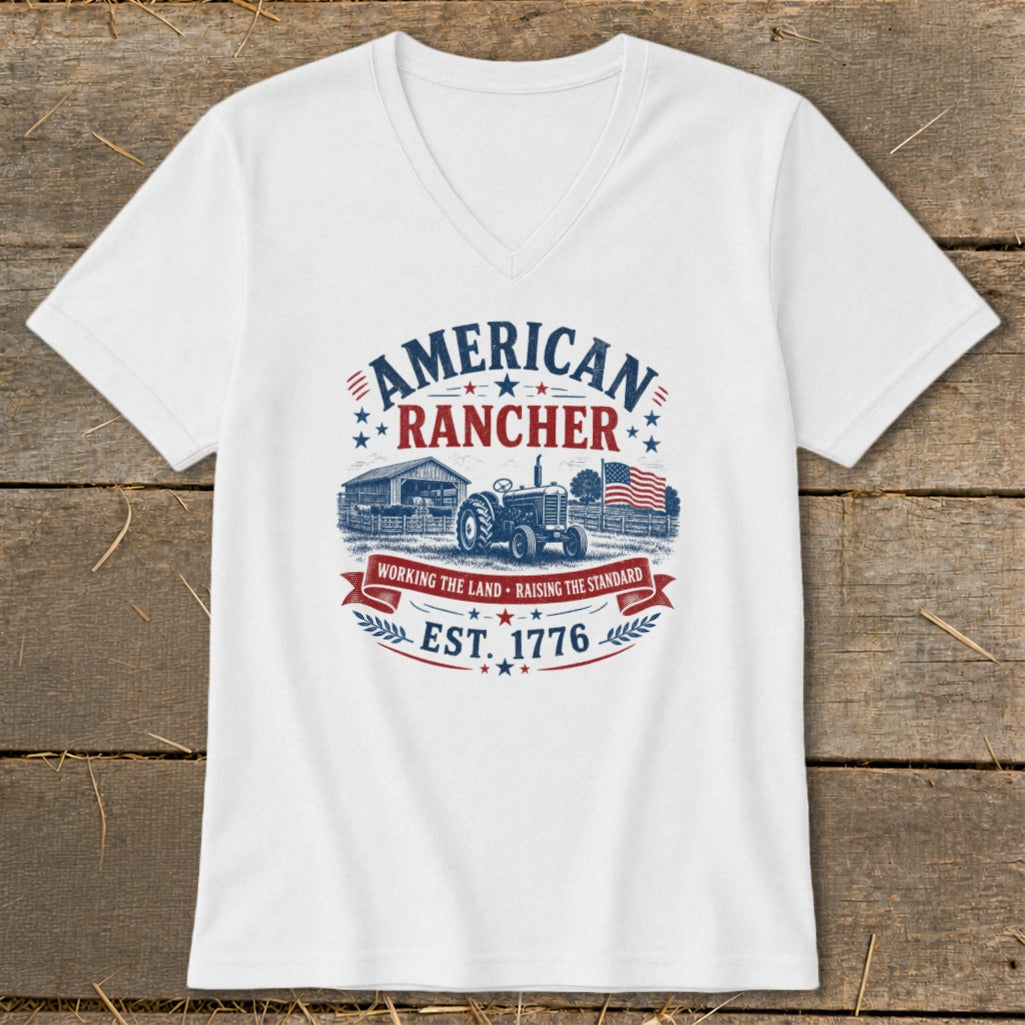 White t-shirt with "American Rancher Est. 1776" graphic featuring a tractor, barn, and flag.