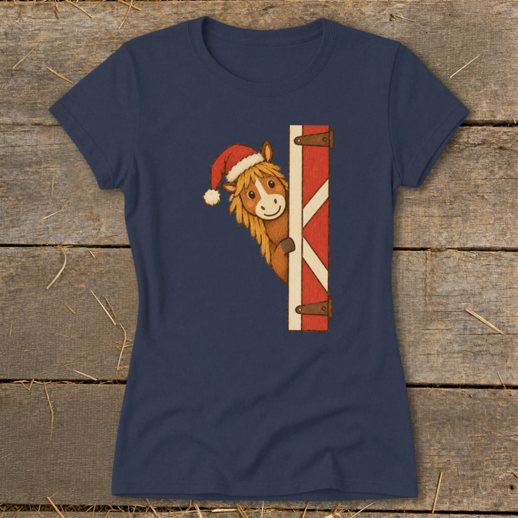 Navy t-shirt with a cartoon horse wearing a Santa hat peeking from a barn door.