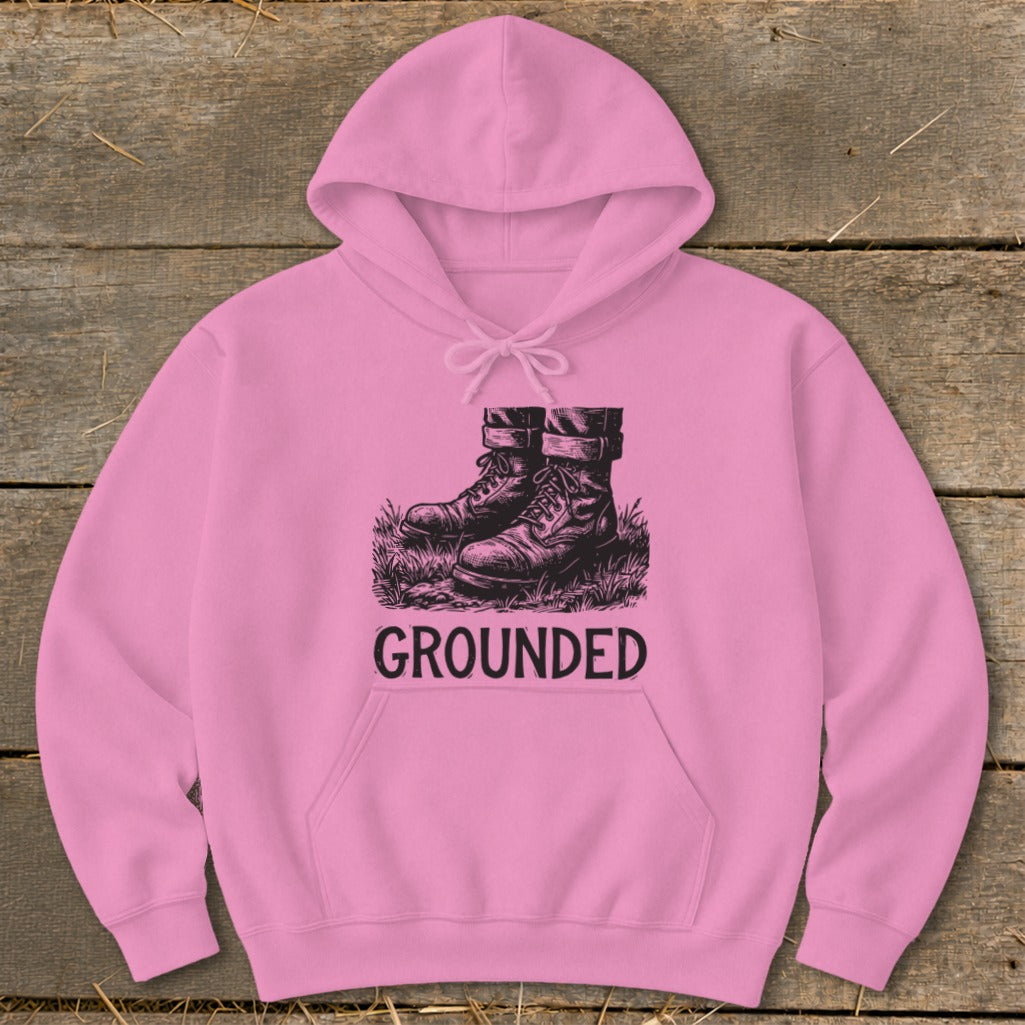 Pink hoodie with black graphic of combat boots and the word "GROUNDED."