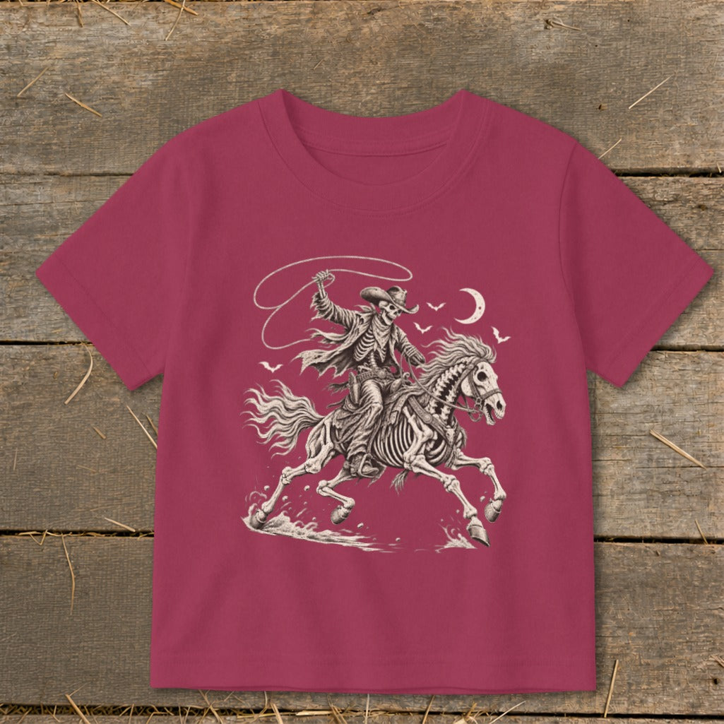 Skeleton cowboy on horseback with lasso under a crescent moon and birds.