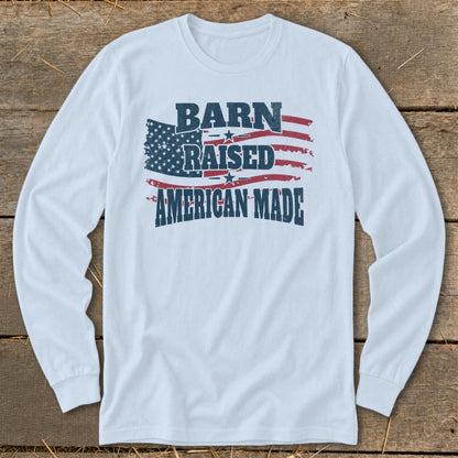 White long sleeve shirt with distressed American flag graphic and text "BARN RAISED AMERICAN MADE".