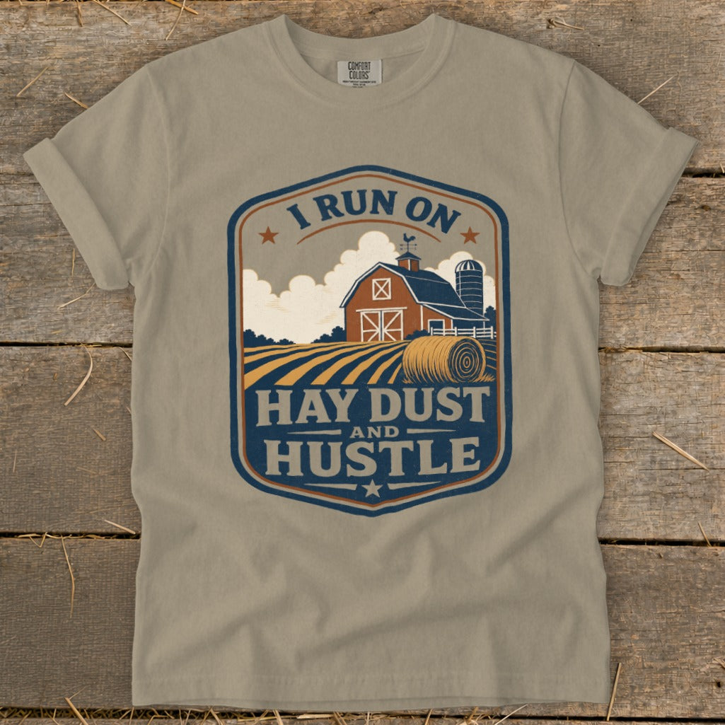 T-shirt with farm graphic and text "I RUN ON HAY DUST AND HUSTLE".