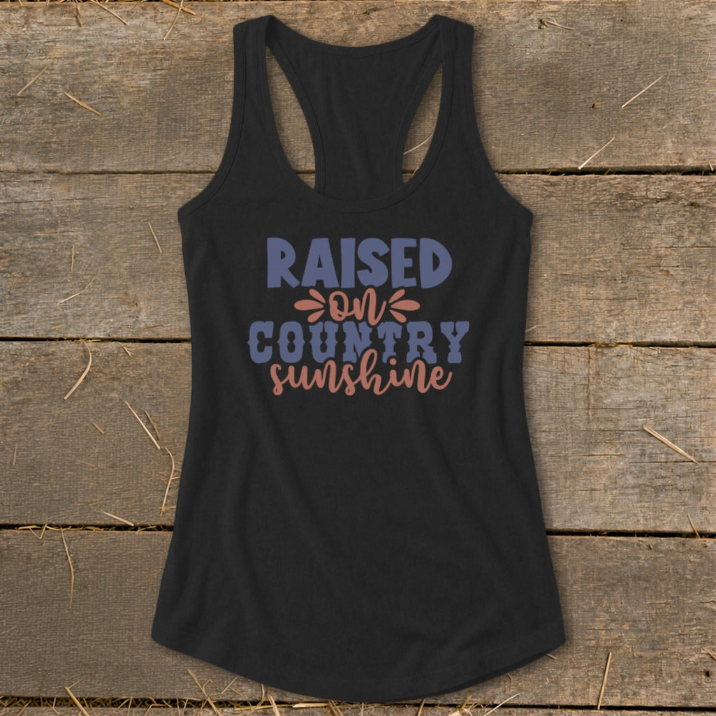 Black tank top with "RAISED ON COUNTRY SUNSHINE" text.