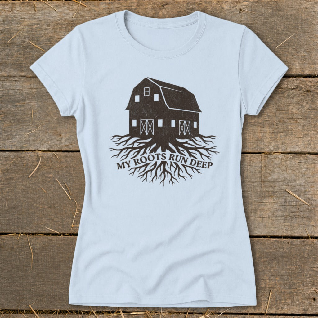 Light blue t-shirt with barn and roots graphic and text "MY ROOTS RUN DEEP".
