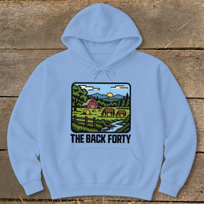 Light blue hoodie featuring a pastoral graphic with horses, a red barn, and the text "The Back Forty".