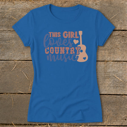 Blue t-shirt with "This Girl Loves Country Music" text and guitar graphic.