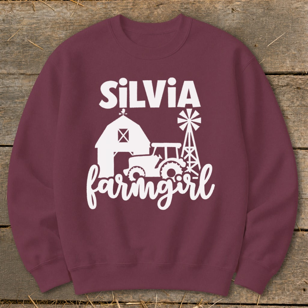 Maroon sweatshirt with white "Silvia farmgirl" text and farm graphics.