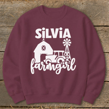 Maroon sweatshirt with white "Silvia farmgirl" text and farm graphics.