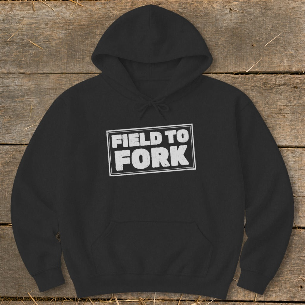 Black pullover hoodie with a white box graphic featuring the text FIELD TO FORK.